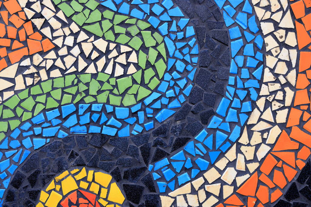 Colorful pattern ceramic tiles or mosaic. Detail of beautiful old collapsing abstract ceramic mosaic adorned building. Venetian mosaic as decorative background. Selective focus. Abstract Pattern. - Photo, Image