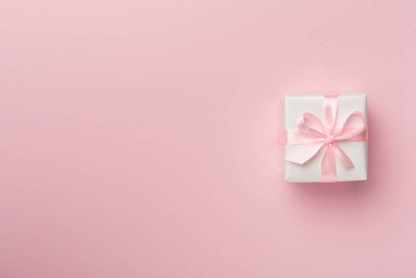 White gift box on color background, top view. - Foto, imagen