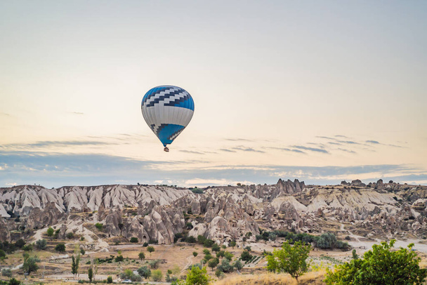 Colorful hot air balloon flying over Cappadocia, Turkey. - Fotó, kép