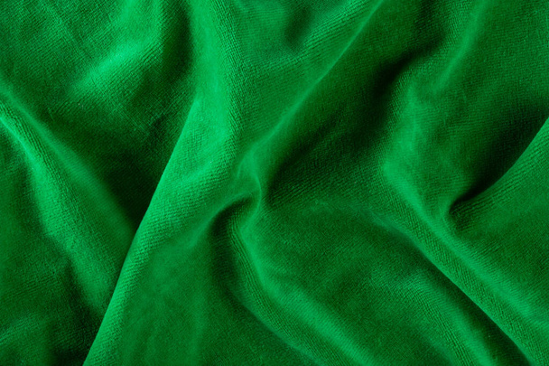 Die Textur eines Mikrofasertuchs in Nahaufnahme. Servietten zum Reinigen und Reinigen grüner Oberflächen. Waschbar - Foto, Bild