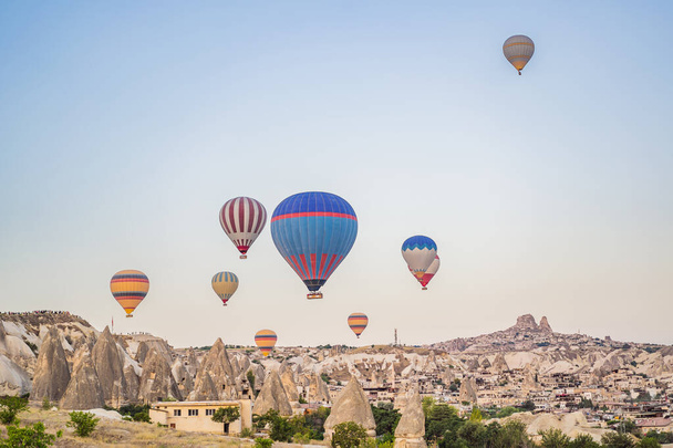 Colorful hot air balloon flying over Cappadocia, Turkey. - Фото, изображение