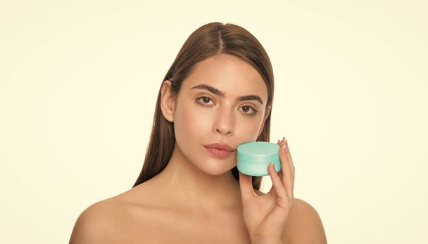 presenting female cosmetic product. woman use face cream. young girl hold hair mask. lady with skin cream. daily habit and personal care. skincare beauty. beauty cosmetic. cleansing scrub. - Fotografie, Obrázek