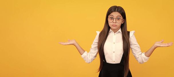 confused child long hair look like nerd. smart kid. girl look through eyeglasses. vision acuity. Child face, horizontal poster, teenager girl isolated portrait, banner with copy space - Photo, Image
