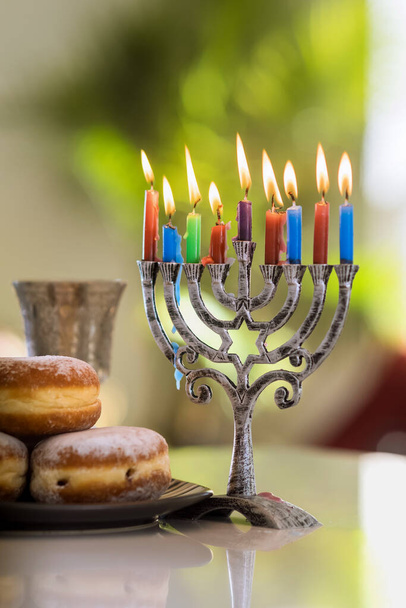 Celebration Hanukkah Judaism tradition family religious holiday symbols of lighting candles on hanukkiah menorah - Photo, Image