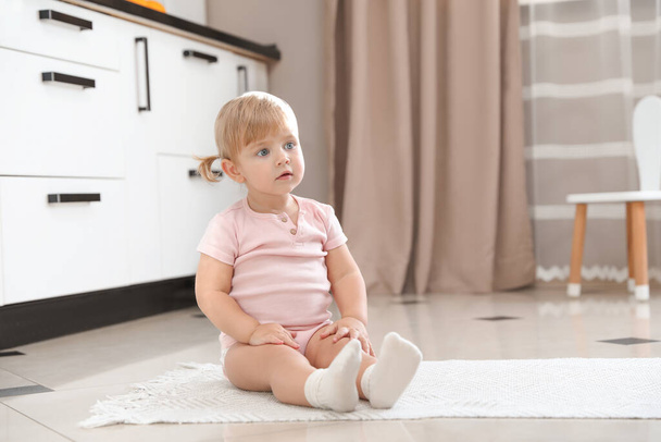 Cute little child sitting on floor at home - Zdjęcie, obraz