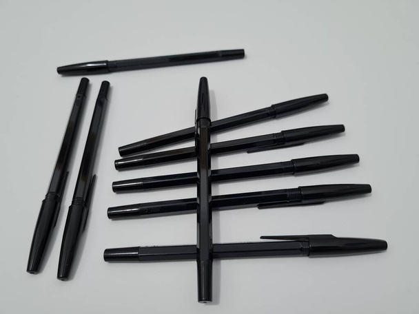 The office equipment used for writing is a black pen - Fotoğraf, Görsel