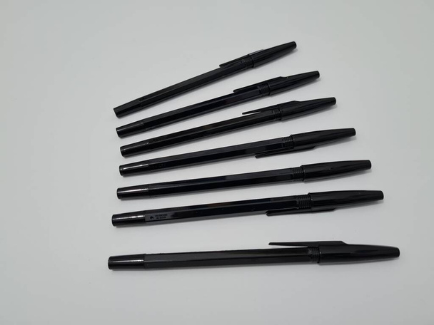 The office equipment used for writing is a black pen - Фото, изображение