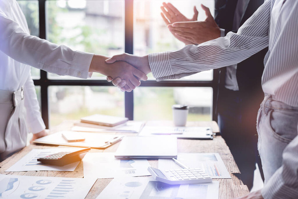 Business handshake for teamwork of business merger and acquisition,successful negotiate,hand shake,two businessman shake hand with partner to celebration partnership and business deal concept - Photo, image