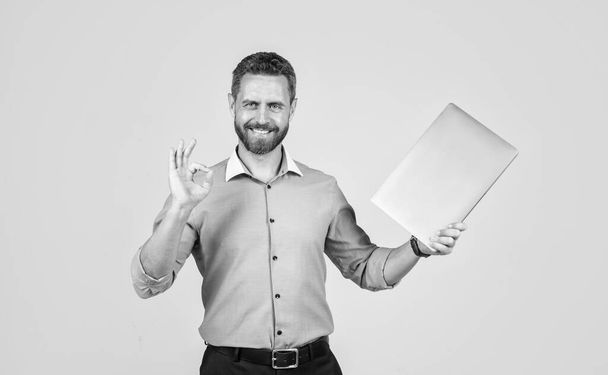 handsome smiling bearded businessman in shirt with laptop, agile business. - Photo, Image