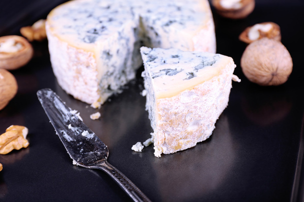 Blue cheese with nuts and blade on metal tray background - Photo, Image