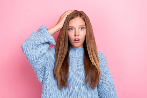 Photo of funny stressed confused nervous schoolgirl teenager touch hand head open mouth scared deadline problem isolated on pink color background. - Foto, Imagem