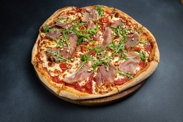 delicious pizza in an Italian restaurant - Fotó, kép