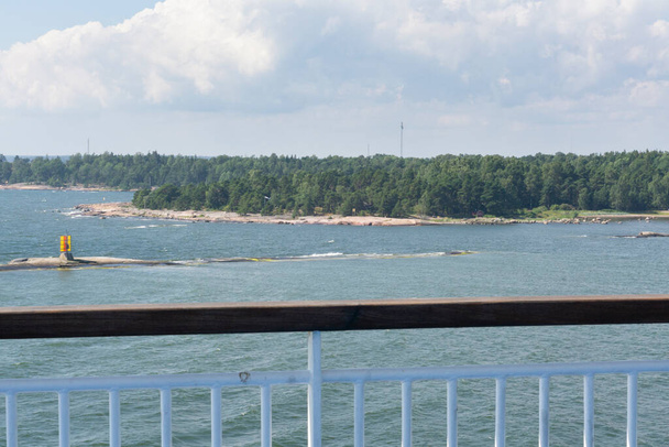 Estonian island at tallinn bay area on sunny day viewed from a cruise ship - Photo, Image