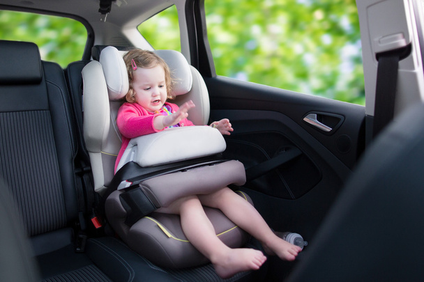 Little girl in car seat - Photo, Image