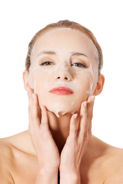 Beautiful woman with collagen mask. - Photo, Image
