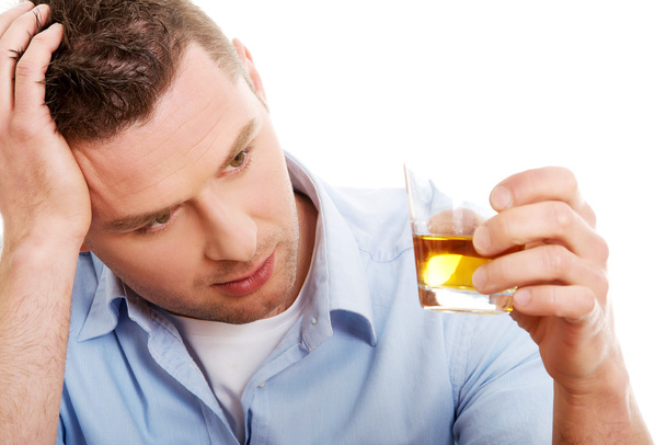 Yound man in depression, drinking alcohol - Foto, Bild