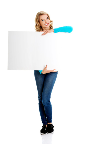 Portrait of happy woman with blank board - Foto, Imagen