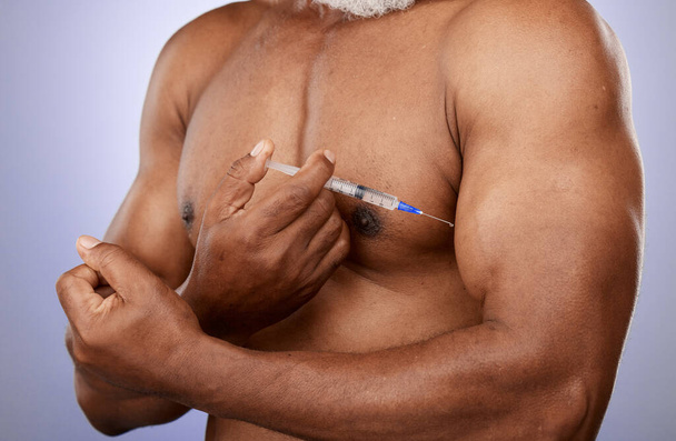 Fitness, steroids and black man with arm injection for biceps growth or muscle development in studio. Sports, supplements and elderly bodybuilder hand holding testosterone hormone chemicals or drugs. - Photo, Image