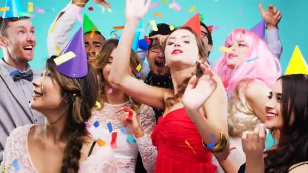 Birthday party, friends and dance celebration of people with fashion, comic and fun hats. Happy, music and dancing crowd together with confetti and club energy in a event or rave photobooth. - Video