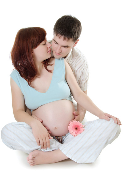 Happy pregnant couple isolated on white - 写真・画像
