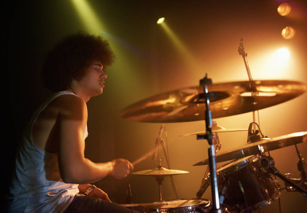 Hes got mad skills. A talented drummer playing drums at a show - Photo, Image
