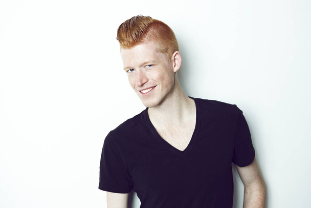 Mr Cool. An trendy redheaded man posing in front of a white background - Fotó, kép