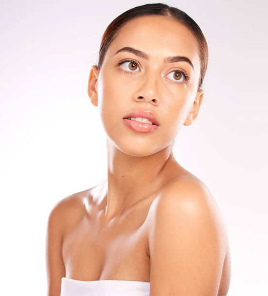 Skincare, makeup and young woman with natural beauty, confident and health with grey studio background. Cosmetics, Latino female or healthy girl with wellness, smooth or clear skin for organic facial. - Fotoğraf, Görsel