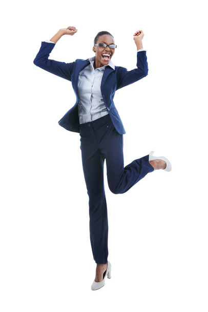Business winner. Full length studio shot of an excited young businesswoman jumping in the air isolated on white - Fotó, kép