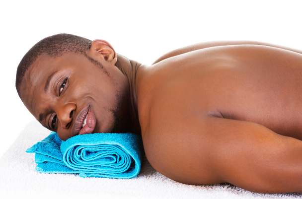 Man lying on a massage table - Fotó, kép