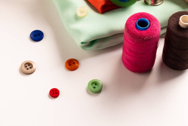 Composition of sewing equipment on white background. National craft month, sewing, clothes and copy space. - 写真・画像