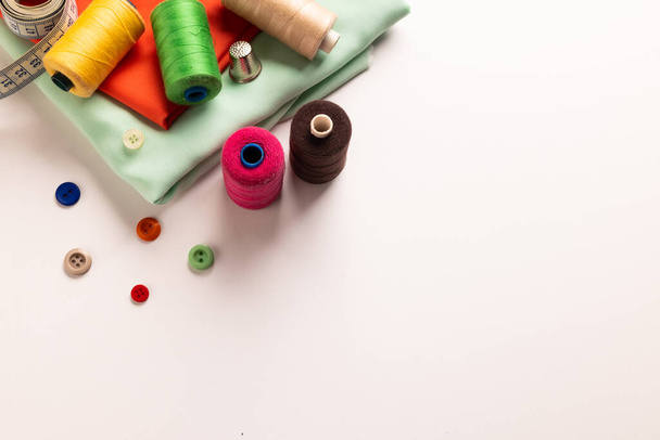Composition of sewing equipment on white background. National craft month, sewing, clothes and copy space. - Foto, Bild