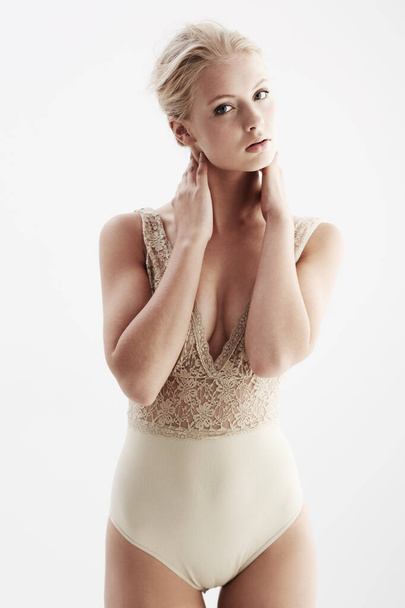 Lovely in lace underwear. A gorgeous blonde woman modeling her lace fashion in a studio shoot - Fotografie, Obrázek