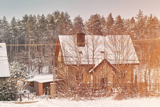 Agriculture house during the winter season. The rural field is covered with snow. - Photo, Image