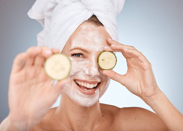 face mask, cucumber and smile for woman skincare beauty wellness, salon spa care or skin health portrait in studio. Luxury facial care, happy dermatology and natural skin therapy or healthy detox. - Photo, image