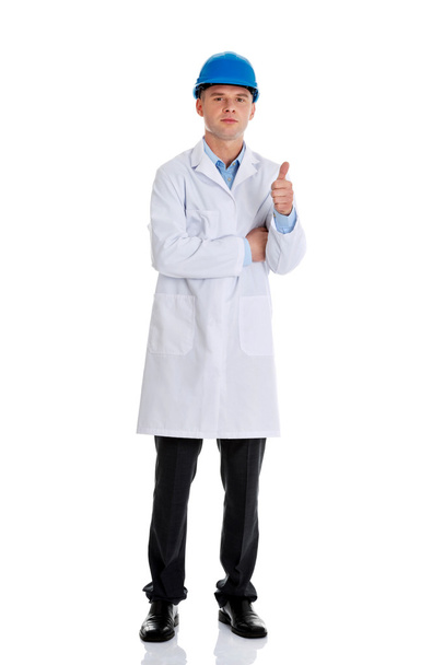 Man in a lab coat and helmet - Photo, Image