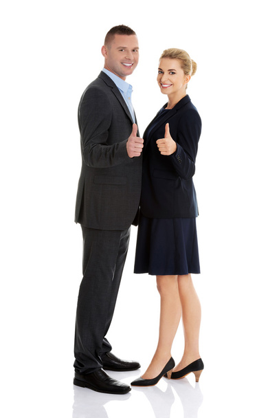 Business couple showing thumbs up - Фото, изображение