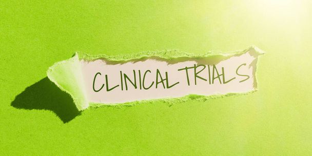 Text caption presenting Clinical Trials, Business idea Research investigation to new treatments to people - Photo, Image