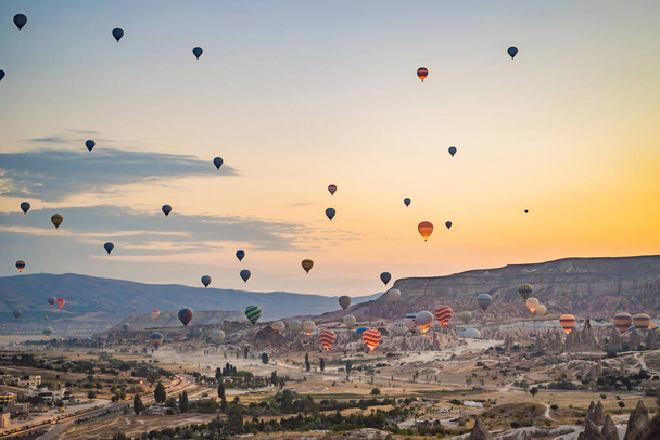 Colorful hot air balloon flying over Cappadocia, Turkey. - Φωτογραφία, εικόνα