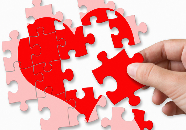 red broken heart made by puzzle pieces - Фото, изображение