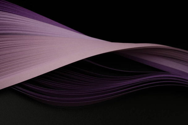 Violet color strip wave paper on black. Abstract texture background. - Фото, зображення