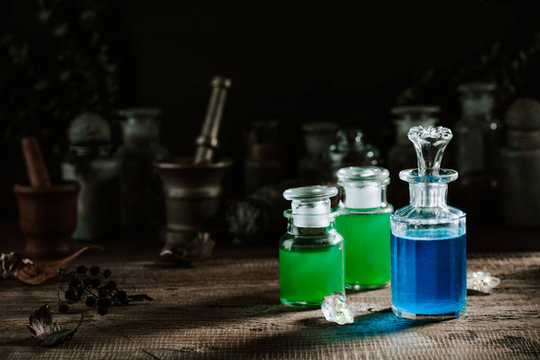 Witchcraft still life concept with potion, herbs ingredients and magical equipment - Fotografie, Obrázek
