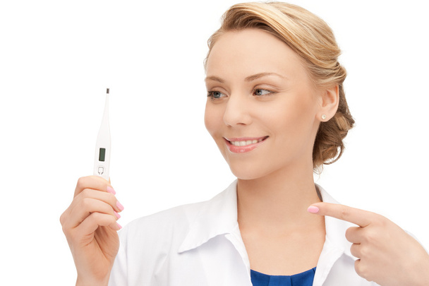 Attractive female doctor with thermometer - Foto, imagen