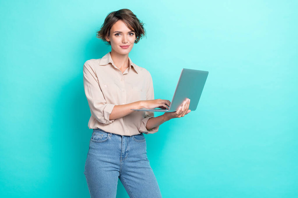 Photo of attractive cute pretty woman wear beige shirt using laptop seminar remote conference worker manager isolated on aquamarine color background. - Foto, immagini
