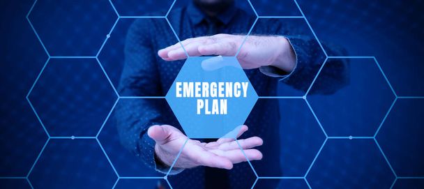 Firma mostrando Plan de Emergencia, Concepto de Internet Procedimientos para la respuesta a emergencias importantes Prepárate - Foto, imagen