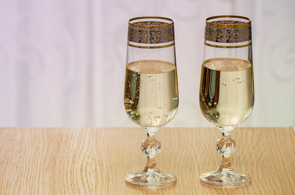 Two champagne flute filled with champagne. - Photo, image