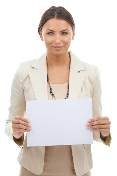 Big ideas for your business. Studio shot of an attractive young businesswoman holding a blank paper isolated on white - Photo, Image