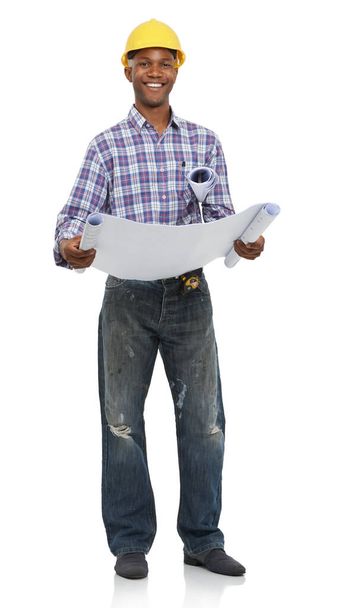 Ready to make these plans a reality. Full length studio portrait of an engineer holding blueprints isolated on white - Photo, Image