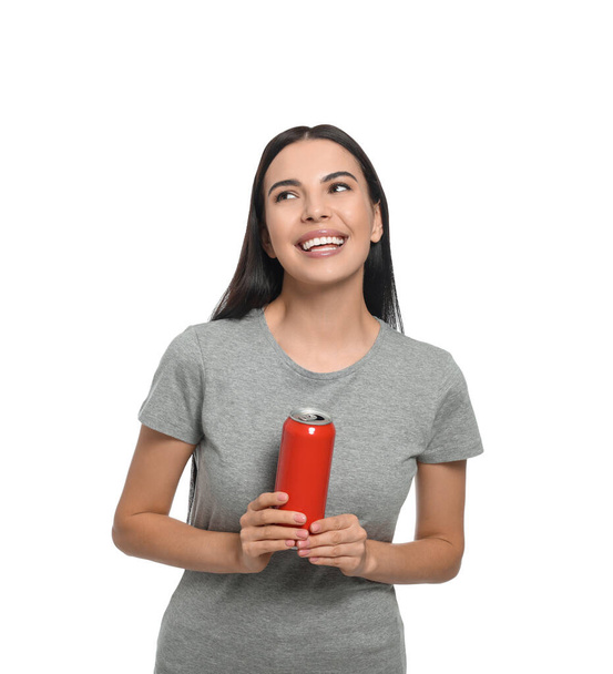 Beautiful happy woman holding red beverage can on white background - 写真・画像