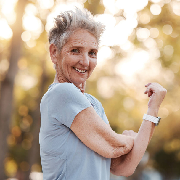 Training, stretching and senior woman in nature for fitness, running and summer workout in Portugal. Health exercise, sports motivation and portrait of an elderly woman with warm up smile in a park. - Foto, Bild