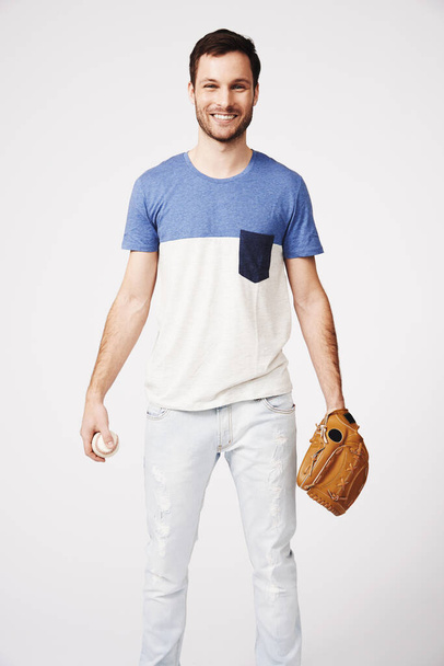 He loves baseball. Portrait of a young man in baseball clothing - Foto, Imagem
